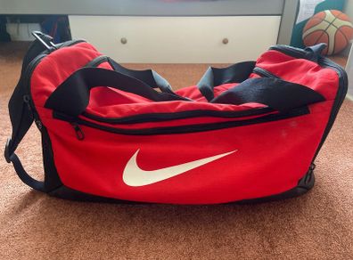 Red Nike sports duffel bag
