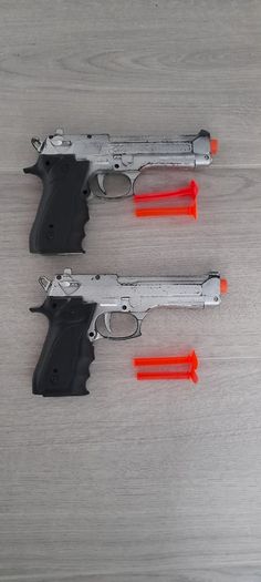 2 toy plastic guns