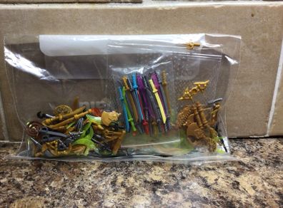 Mix bag of Lego weapons /swords