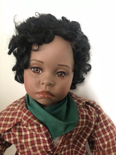 Lifelike doll in cute western clothes