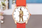 Elvis Presley themed wristwatch with orange strap