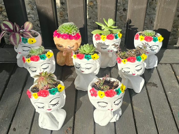 small handmade flower pots with real plants
