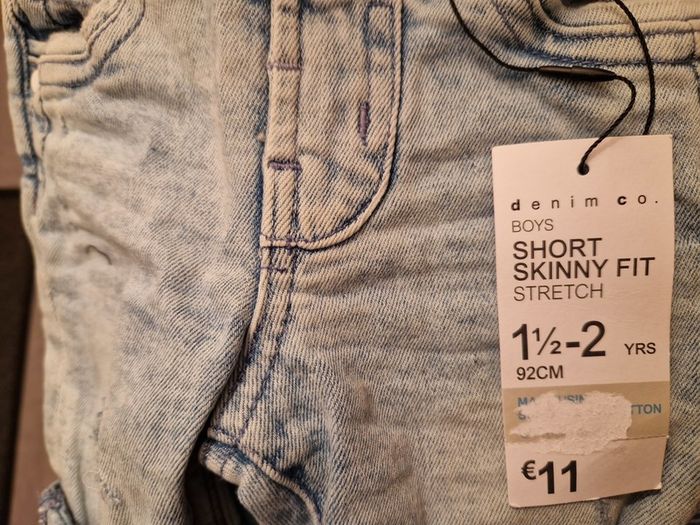A selection of brand new baby clothes and items
