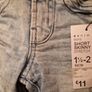 A selection of brand new baby clothes and items Image 5