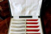 Cased set of art deco butter knives
