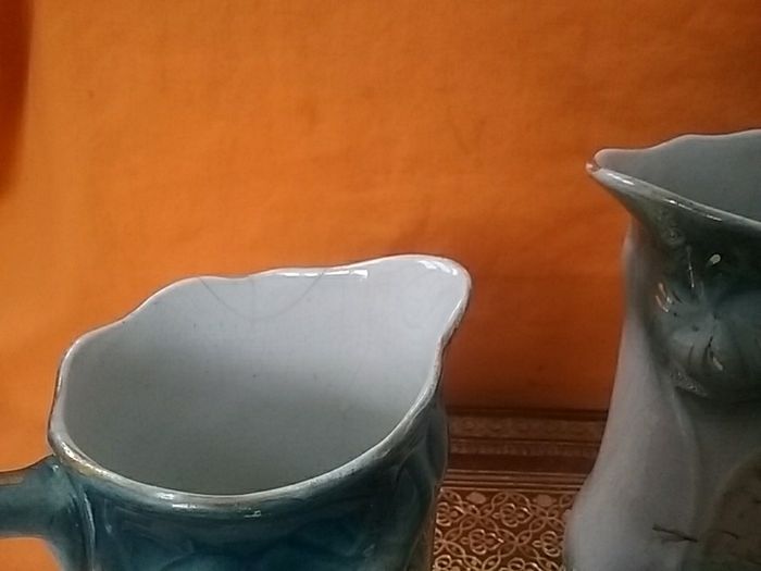 Two Graduated Antique Jugs