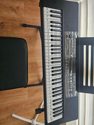Barely used 61 keys  keyboard with stand and stool in perfect condition, model no SM-61K