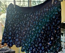 Blue ditsy floral pleated mini skirt.