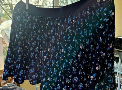 Blue ditsy floral pleated mini skirt.