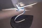 1970s chrome airplane on stand