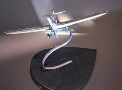 1970s chrome airplane on stand