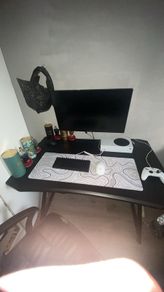 Gaming table with cup holder and headset holder