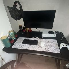 Gaming table with cup holder and headset holder