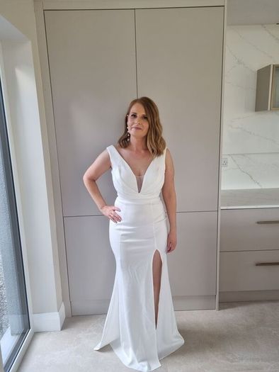 white full length v neck dress with side split