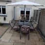garden table with six chairs and parasol Image 2