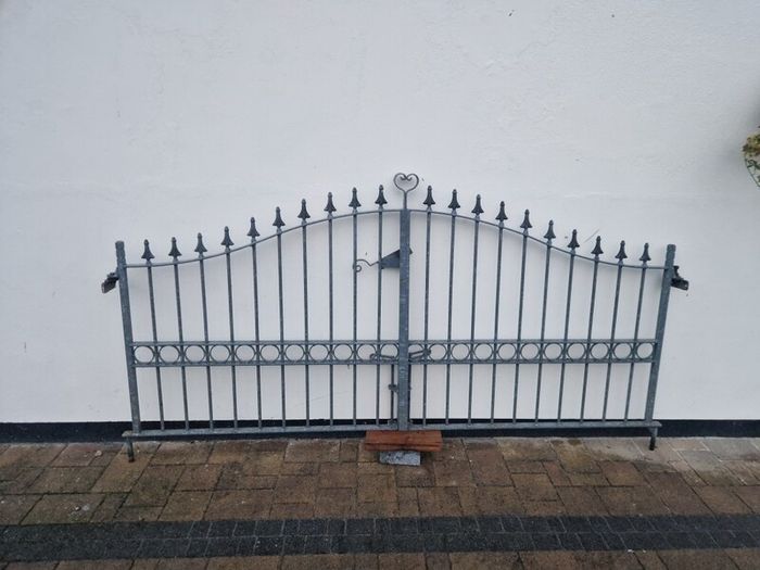 Decorative galvanised double steel gates.
