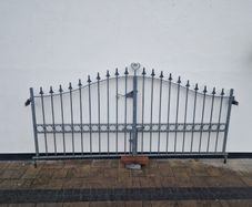 Decorative galvanised double steel gates.