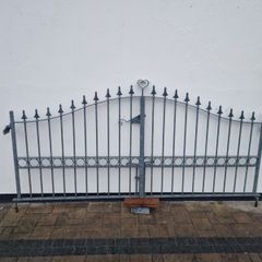 Decorative galvanised double steel gates.