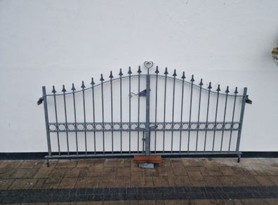 Decorative galvanised double steel gates.