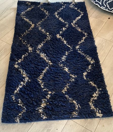 2 x navy and white rugs.