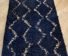 2 x navy and white rugs.