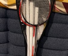 2 badminton rackets with net.