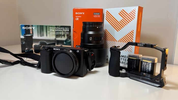 Sony ZVE-10 + Sony E 18-105mm f/4 lens (cage and 5 batteries)
