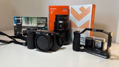 Sony ZVE-10 + Sony E 18-105mm f/4 lens (cage and 5 batteries)