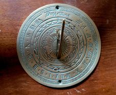 Vintage engraved brass sundial