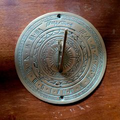 Vintage engraved brass sundial