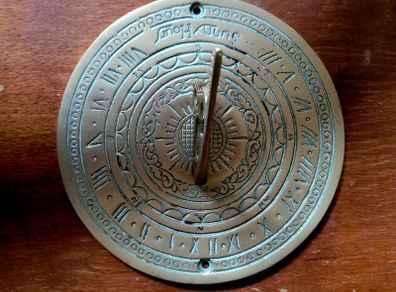 Vintage engraved brass sundial
