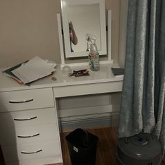 Woman's make up dressing table with chair and mirror