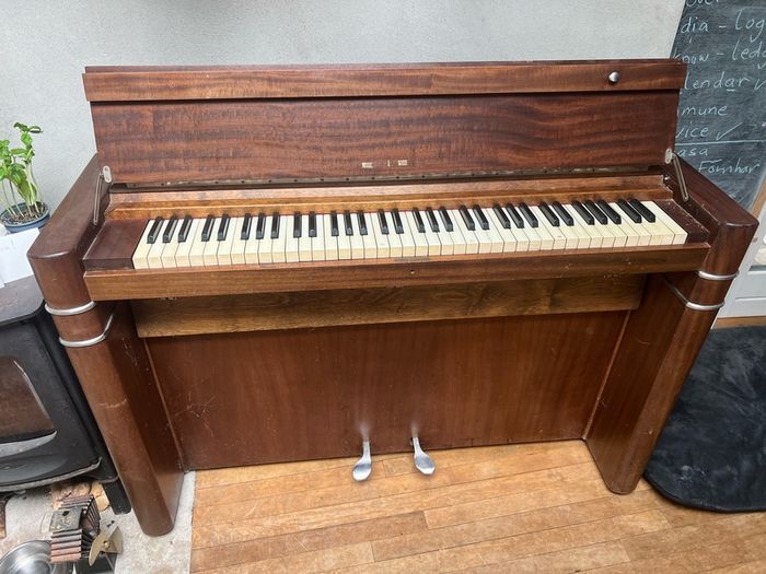 compact art deco piano