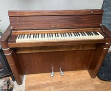 compact art deco piano