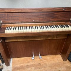 compact art deco piano