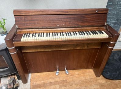 compact art deco piano