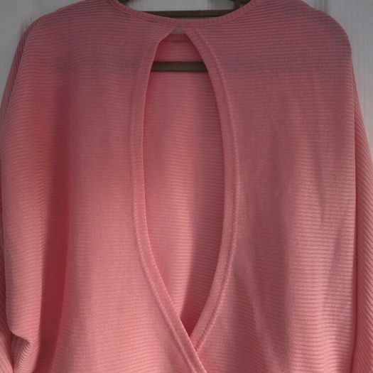 Pink long sleeve top cut back, size 10