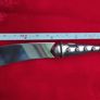 A collectible knife made of polished pewter with a stainless steel blade from Carrol Boyes. Image 5