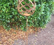 Corten steel garden sphere on a stem