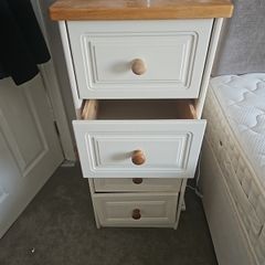 pair of cream bedside lockers