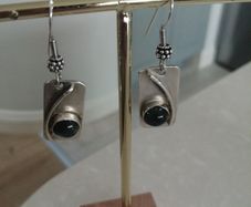 Bespoke sterling silver drop earrings with blue topaz