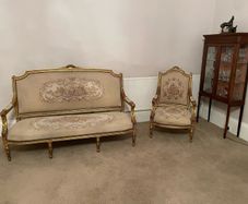 Louis XVI-style gilt settee and armchair, tapestry upholstery