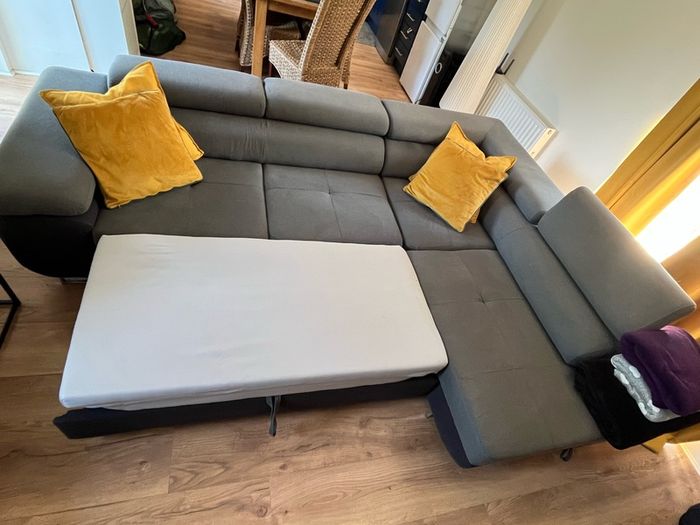 Sofa bed with reclining headrests