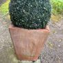 Pair of terracotta pots with artificial plants Image 2