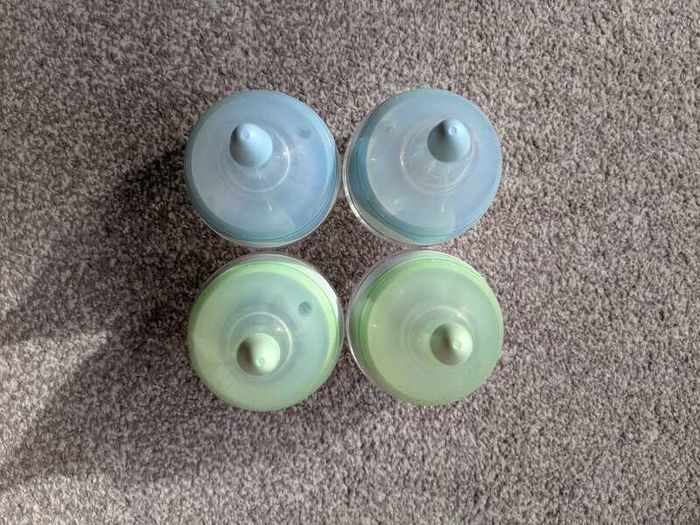 4 small glass baby bottles