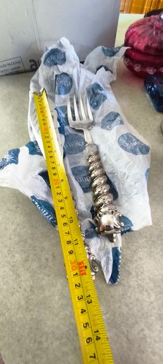 Silver-plated utensil fish carving set or serving set, noted by the specific shape of the knife blade.