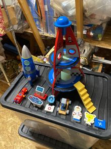 toy rocket and rocket money box