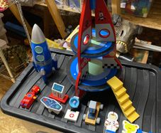 toy rocket and rocket money box