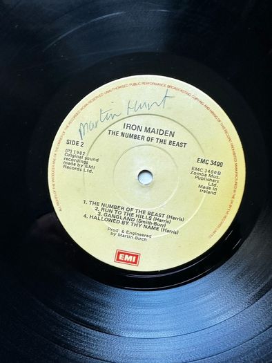 Iron Maiden. Irish release The number of the beast. Outer sleeve is vg+ inner sleeve is vg with some small age marks on 1 side. Vinyl is vg with some light wispy scuff marks and writing on 1 label