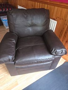 dark brown faux leather armchair.